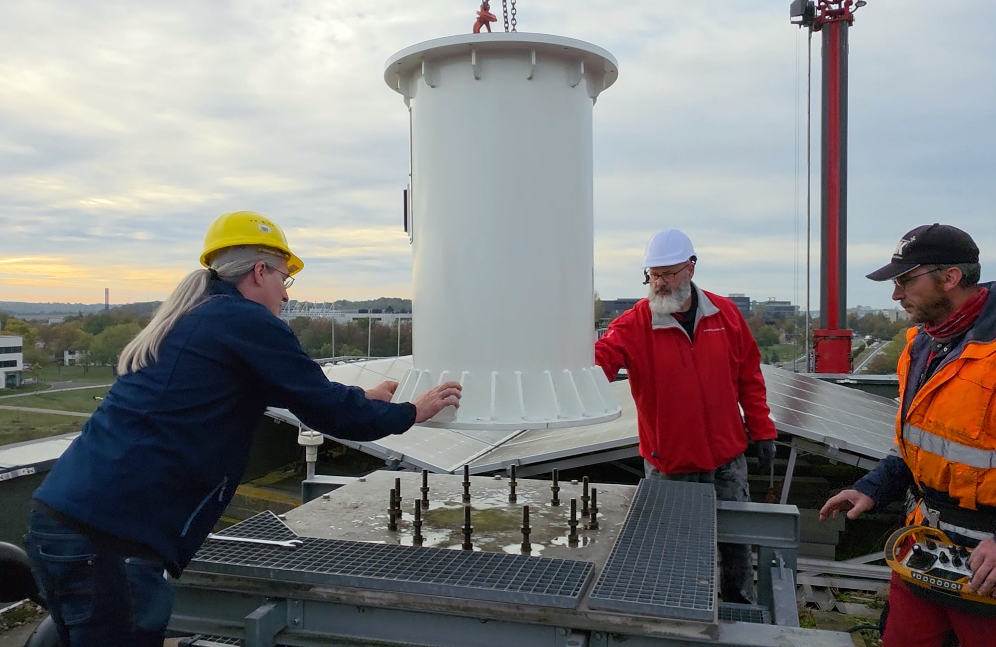 Installing the new column on the existing rooftop anchors