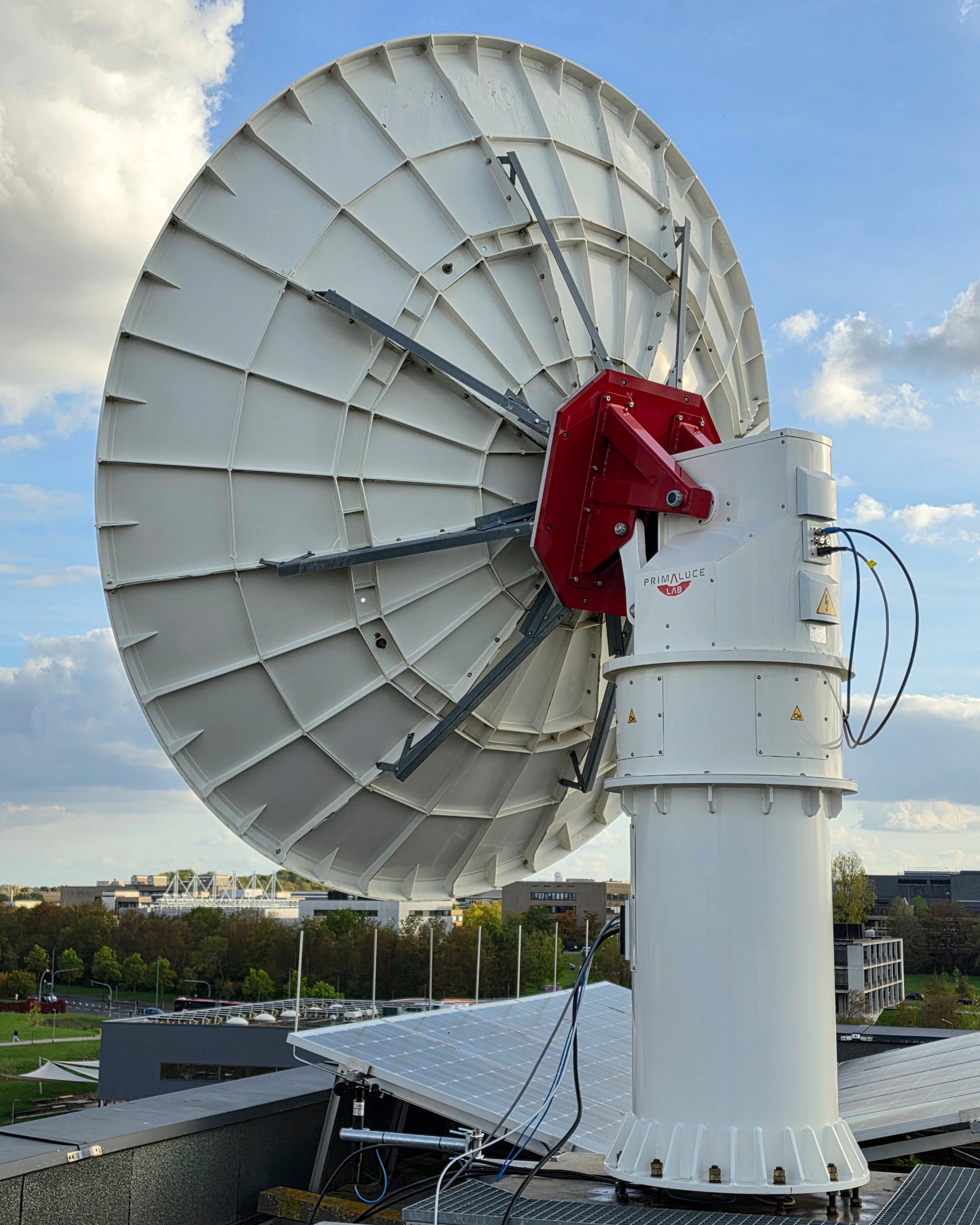 Upgraded 3-meter ground station antenna of Zentrum für Telematik, installed on the rooftop of building in Würzburg